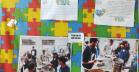 Painéis com fotos e desenhos, de estudantes com TEA